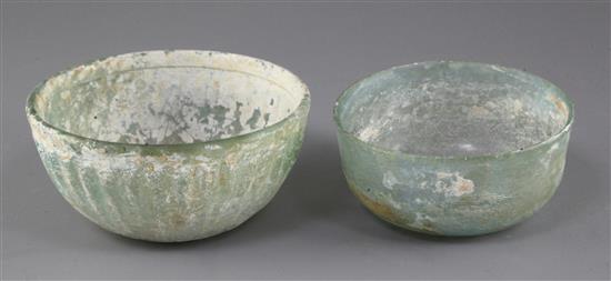 Two Roman pale green glass bowls, 2nd to 4th century AD, diameter 12cm and 10cm